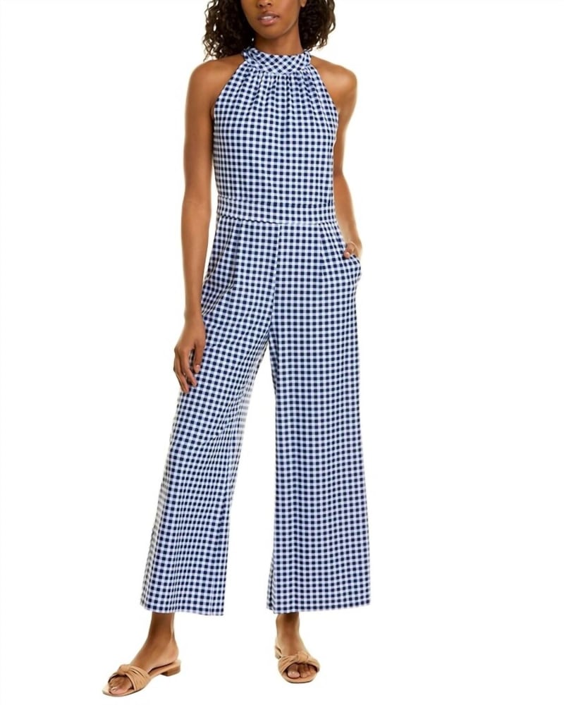 Front of a model wearing a size XL Isabelle Gingham Jumpsuit In Navy in Navy by JUDE CONNALLY. | dia_product_style_image_id:359539